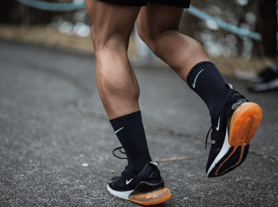 man-running-in-bright-sneakers